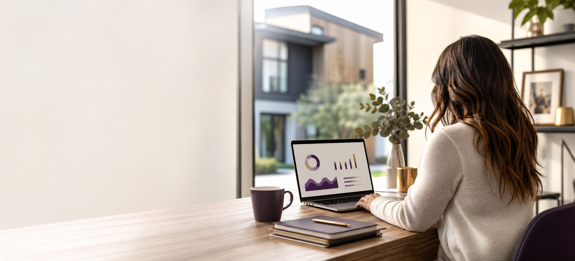 A business owner reviewing a financing dashboard at a desk